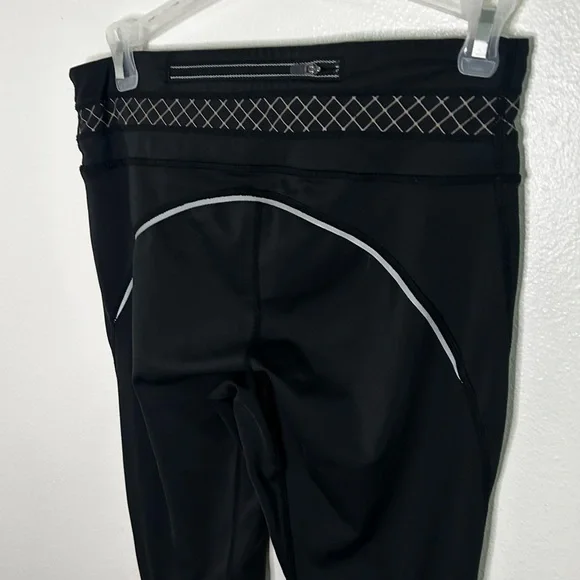 Athleta Miles Compression tights with reflective strips - Picture 7 of 8